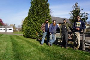 Miko Team Leaning on Fence